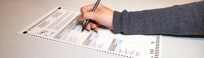 voter marking a ballot
